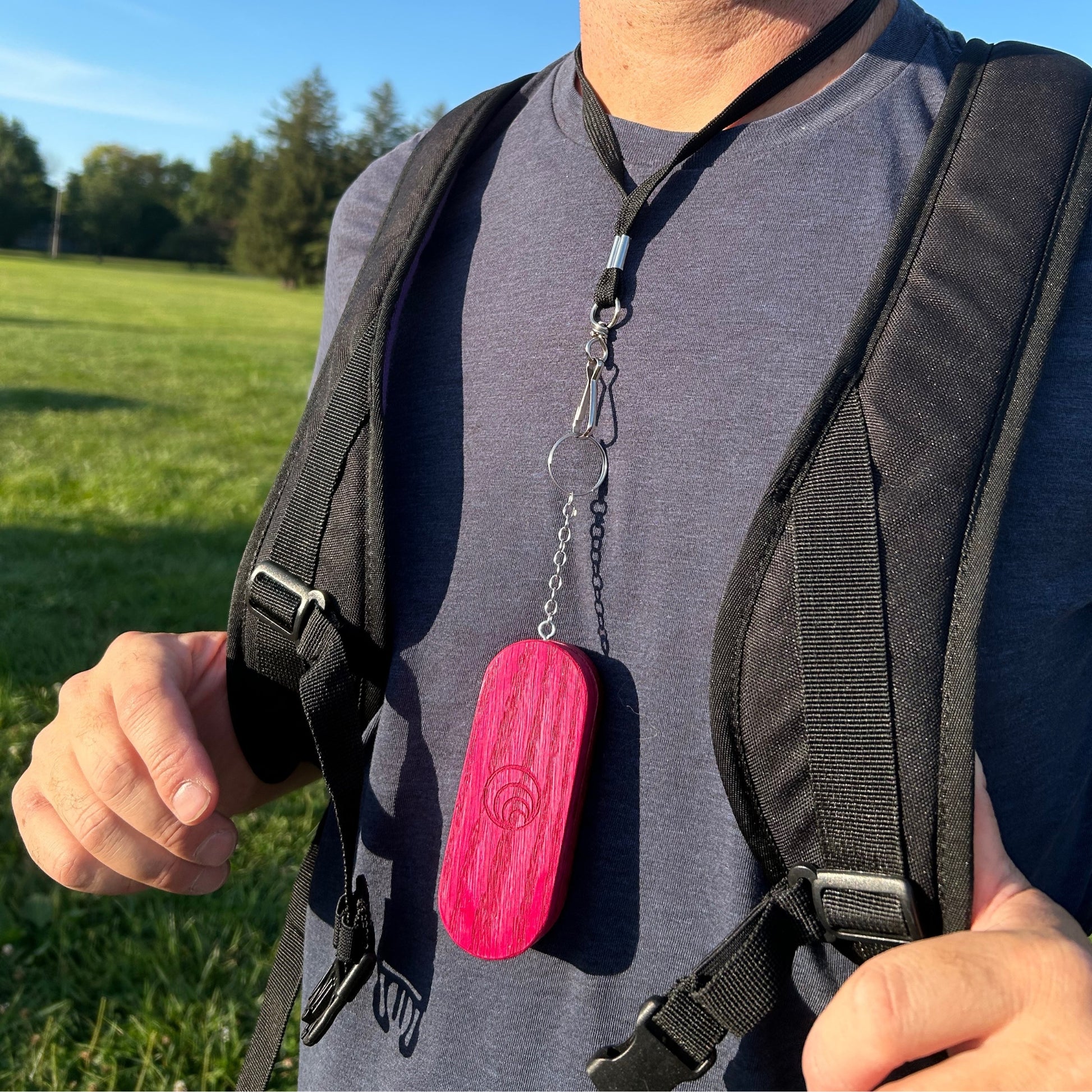 Built-In Keychain Feature: A view of the built-in keychain attached to the carrying case, demonstrating its functionality for easy travel and attachment to keys or a bag.